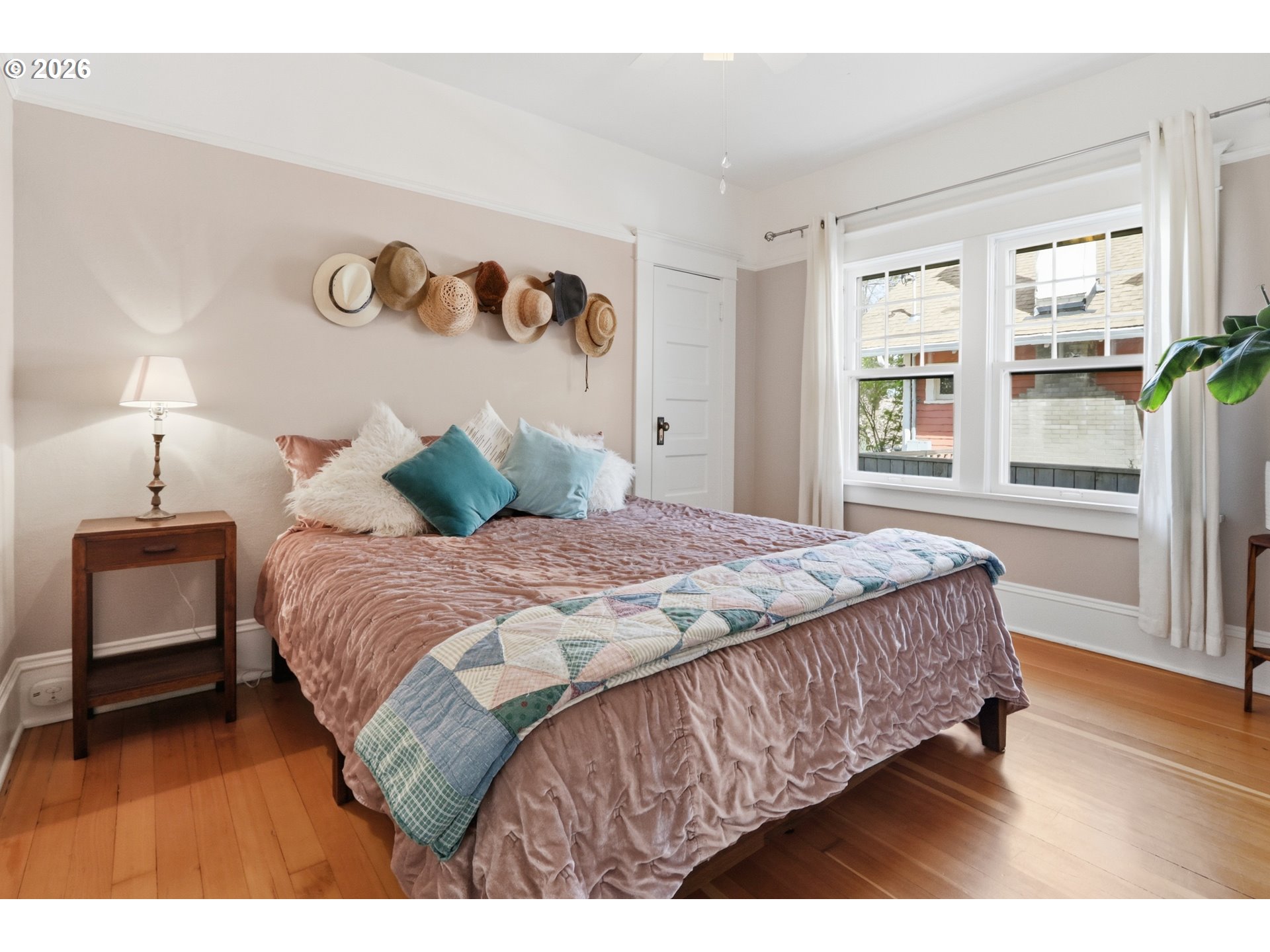3326 Northeast 60th Avenue Portland, OR 97213 - Photo 17 of 46 a bedroom with a large bed and a window