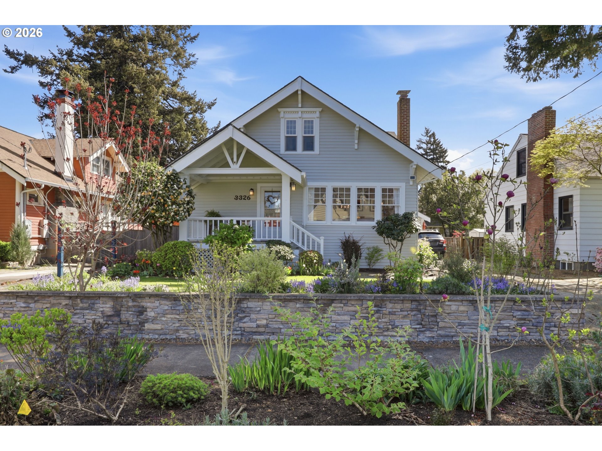 3326 Northeast 60th Avenue Portland, OR 97213 - Photo 2 of 46 a front view of a house with a yard