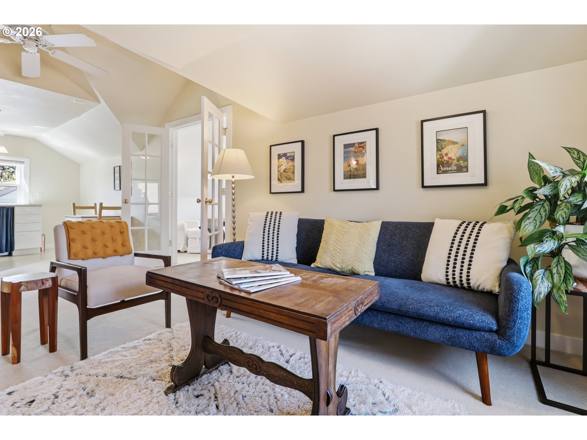 3326 Northeast 60th Avenue Portland, OR 97213 - Photo 23 of 46 a living room with furniture a rug and a potted plant