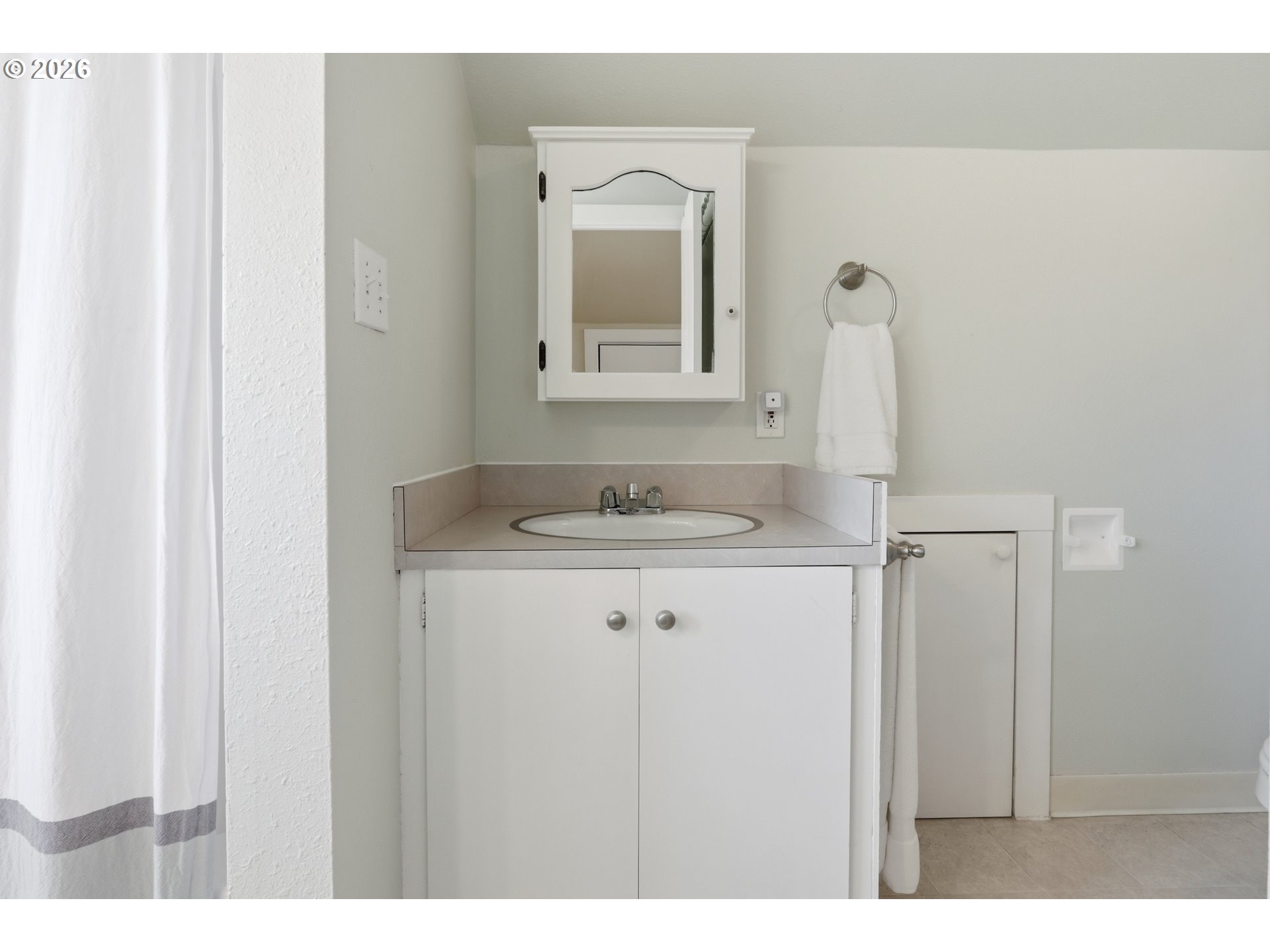 3326 Northeast 60th Avenue Portland, OR 97213 - Photo 27 of 46 a bathroom with a granite countertop sink and a mirror