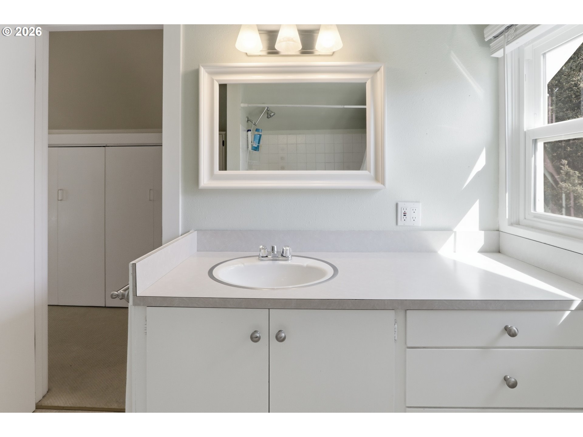 3326 Northeast 60th Avenue Portland, OR 97213 - Photo 29 of 46 a bathroom with a sink and a mirror