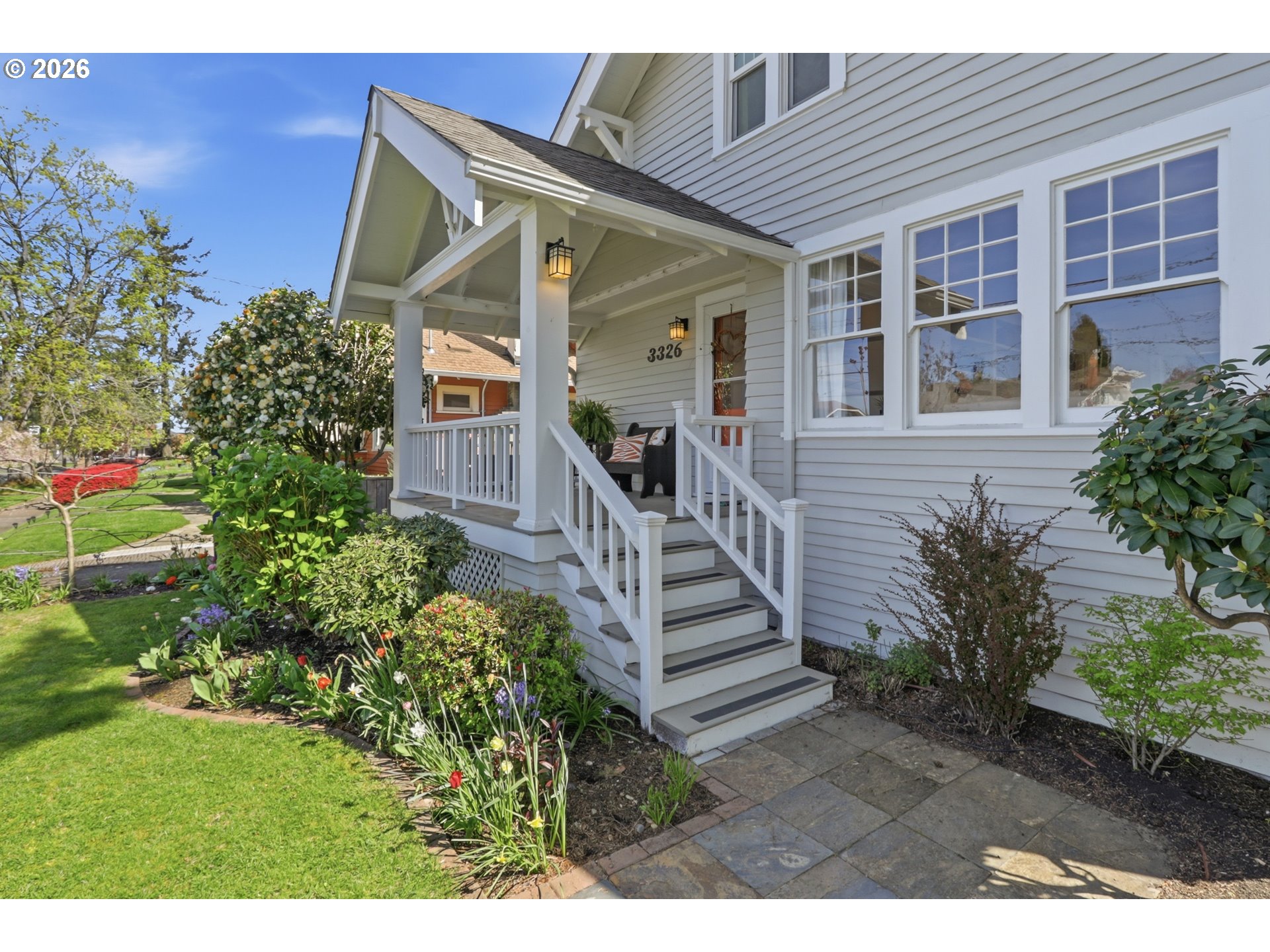3326 Northeast 60th Avenue Portland, OR 97213 - Photo 3 of 46 a view of a house with potted plants and a bench