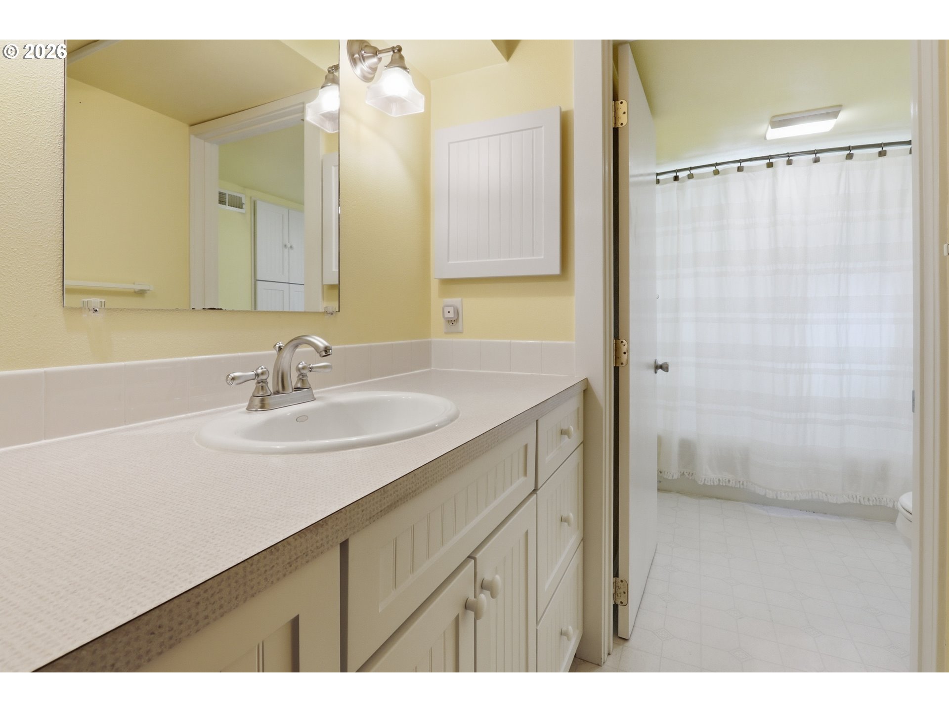 3326 Northeast 60th Avenue Portland, OR 97213 - Photo 39 of 46 a bathroom with a sink and a mirror