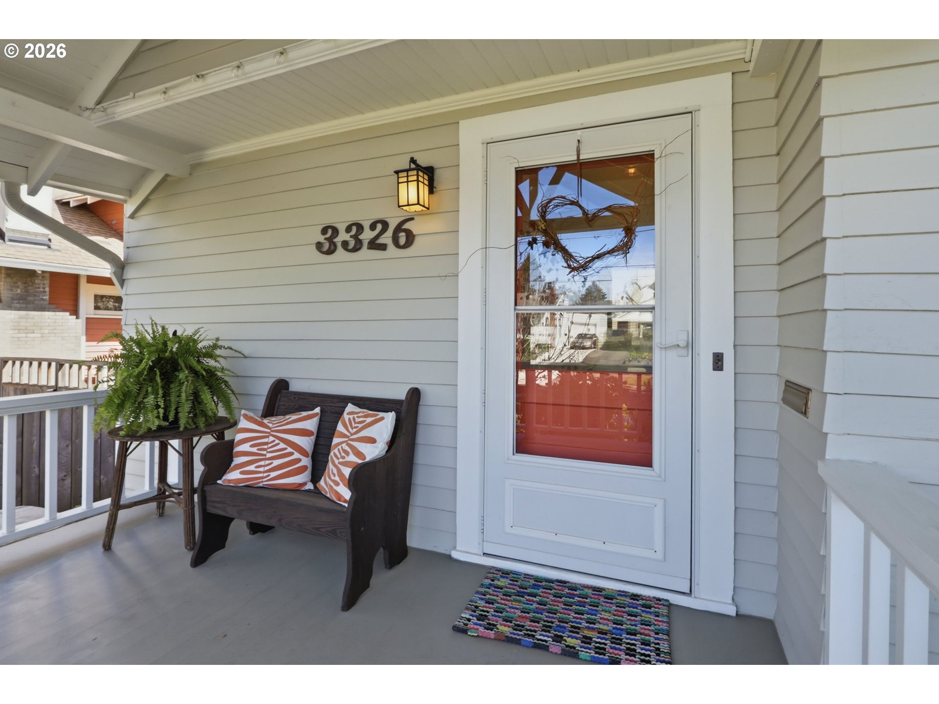 3326 Northeast 60th Avenue Portland, OR 97213 - Photo 4 of 46 a picture of a bench in front of a house