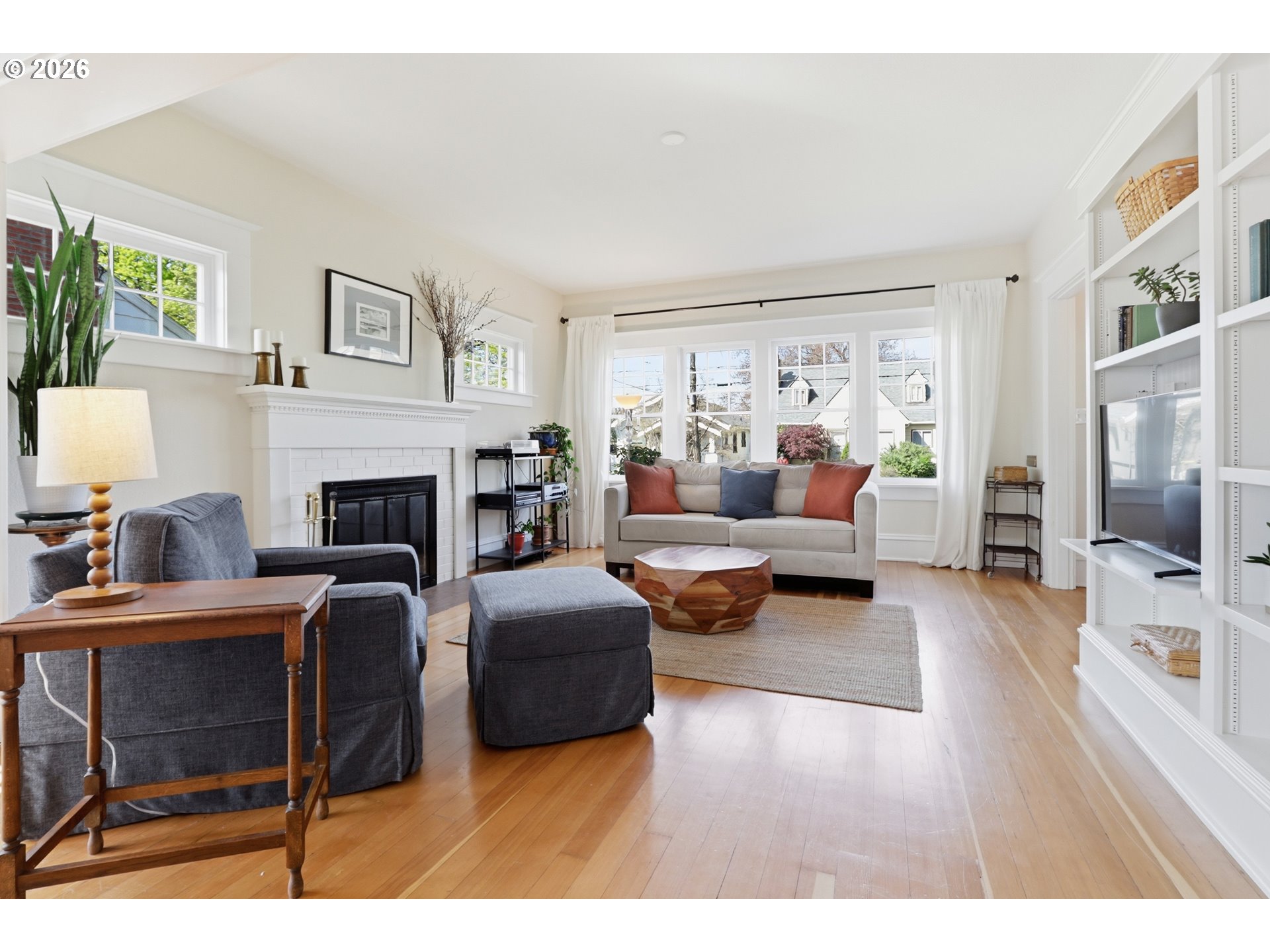 3326 Northeast 60th Avenue Portland, OR 97213 - Photo 8 of 46 a living room with furniture and a fireplace