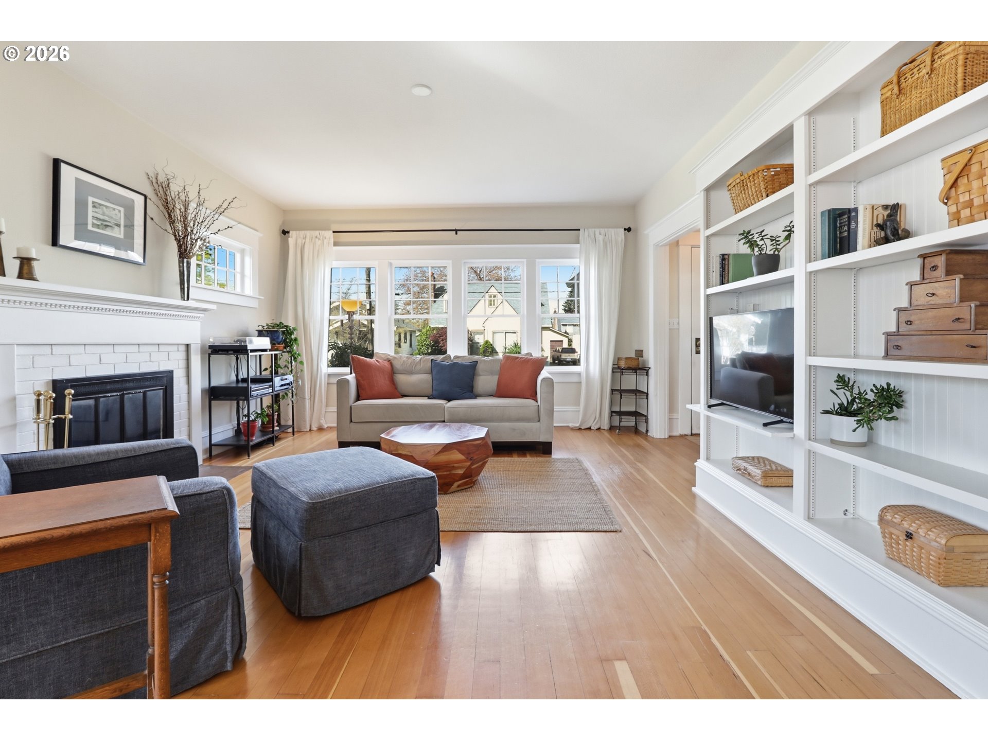 3326 Northeast 60th Avenue Portland, OR 97213 - Photo 9 of 46 a living room with furniture and a flat screen tv