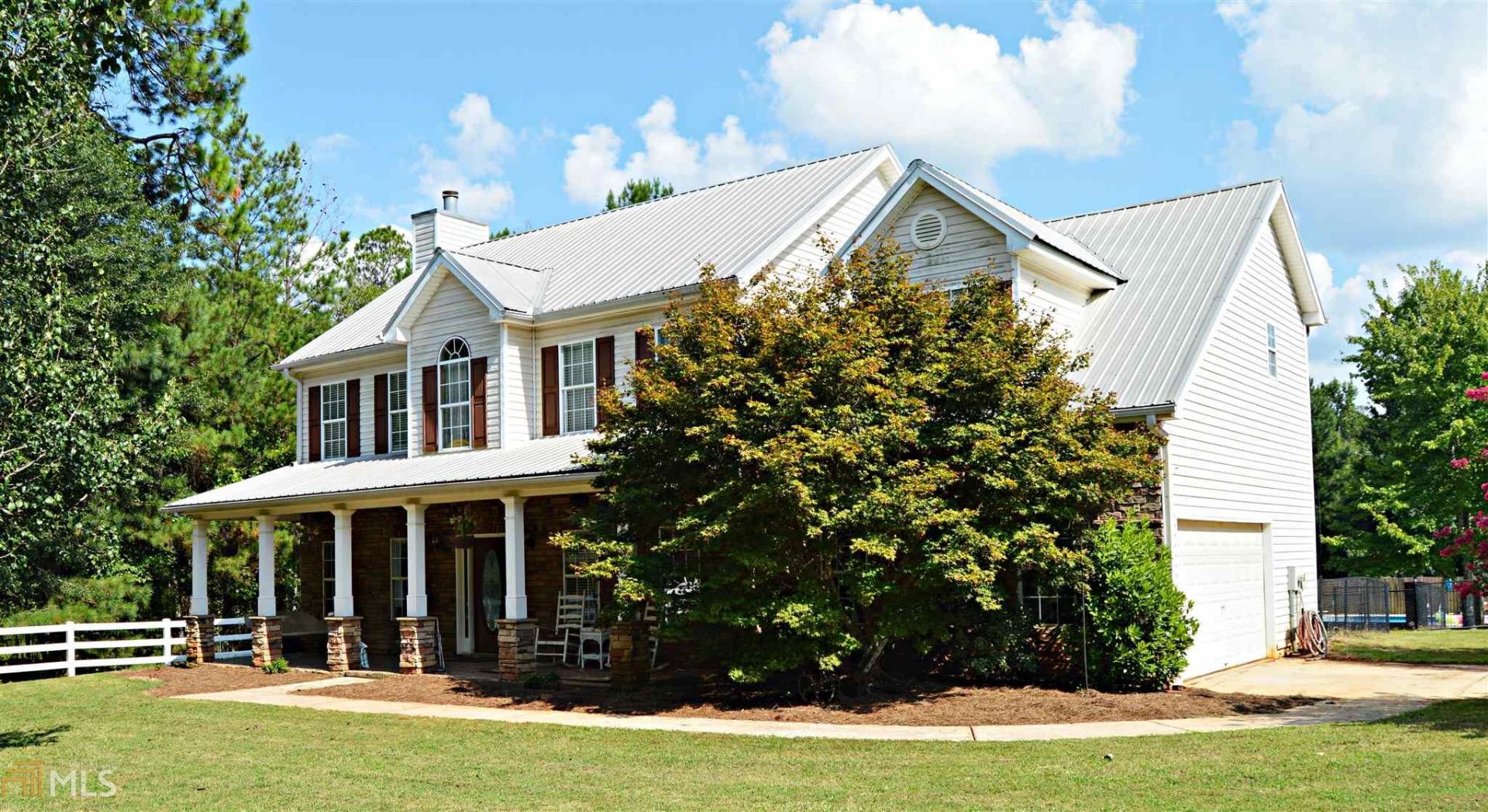 3142 Peeksville Road Locust Grove, GA 30248 - Photo 1 of 1 a view of a house with yard and deck