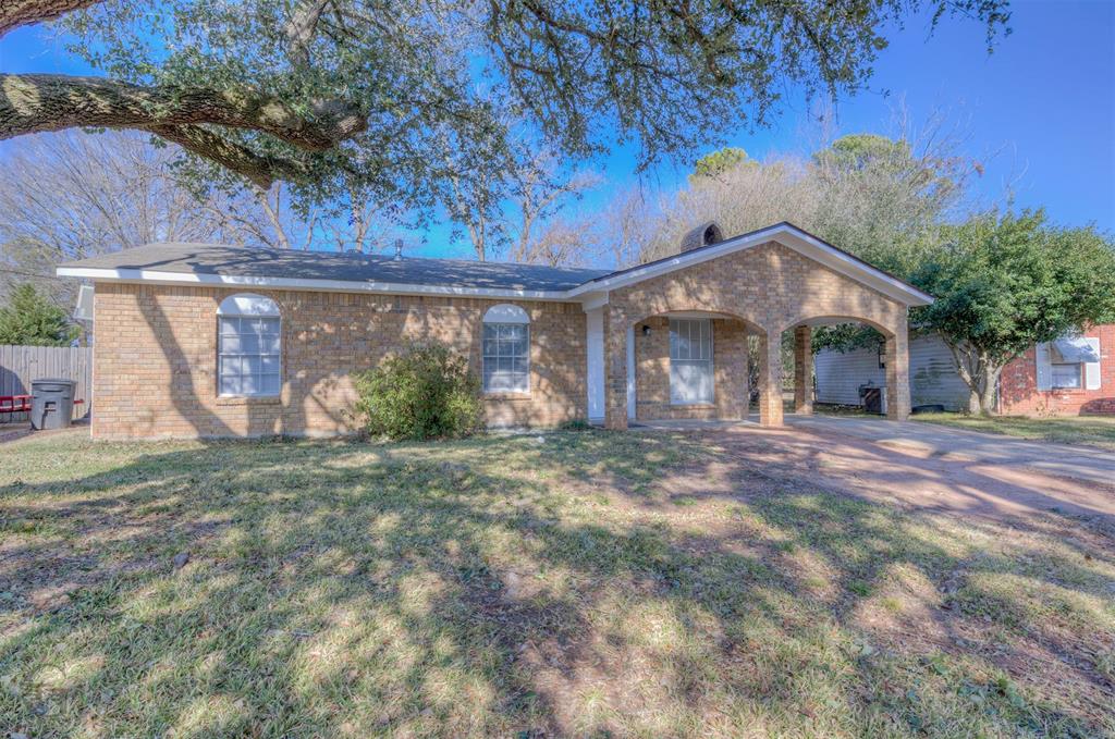 Nice covered front porch with single car carport... love the shade of the tree will provide in the summer.