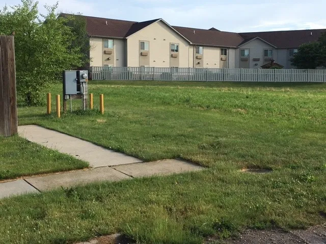 a view of house with backyard and garden