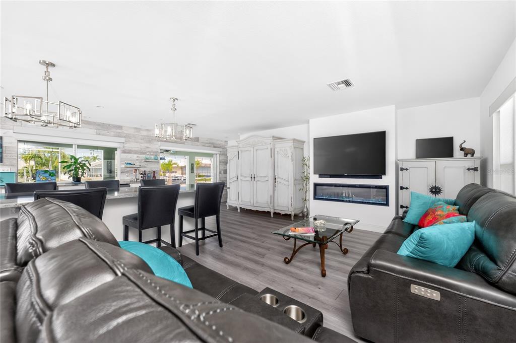 391 Vía Esplanade Punta Gorda, FL 33950 - Photo 14 of 60 a living room with furniture and a flat screen tv