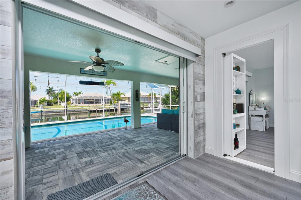 391 Vía Esplanade Punta Gorda, FL 33950 - Photo 17 of 60 a view of room with window and wooden floor