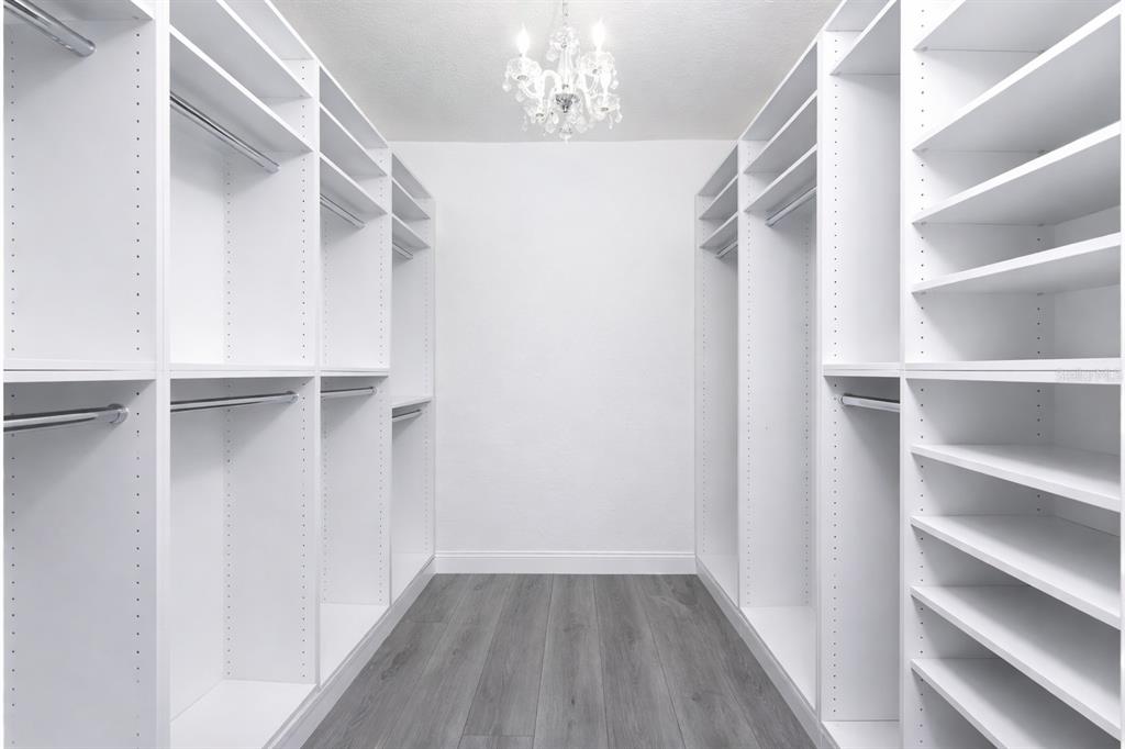 391 Vía Esplanade Punta Gorda, FL 33950 - Photo 22 of 60 a view of walk in closet with empty racks