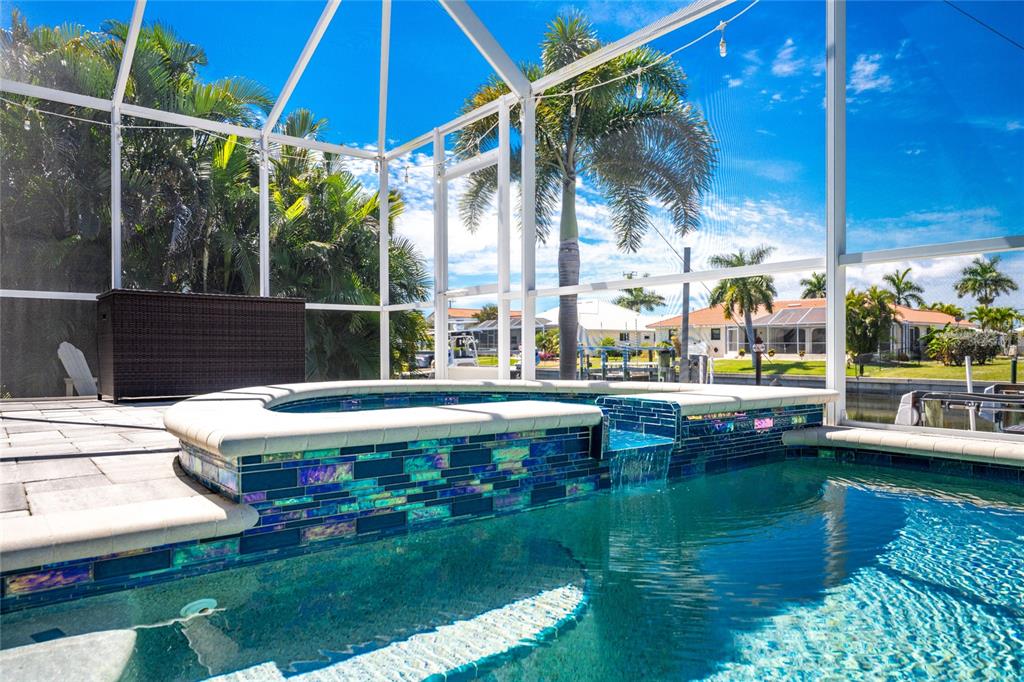 391 Vía Esplanade Punta Gorda, FL 33950 - Photo 28 of 60 a view of house with swimming pool outdoor seating
