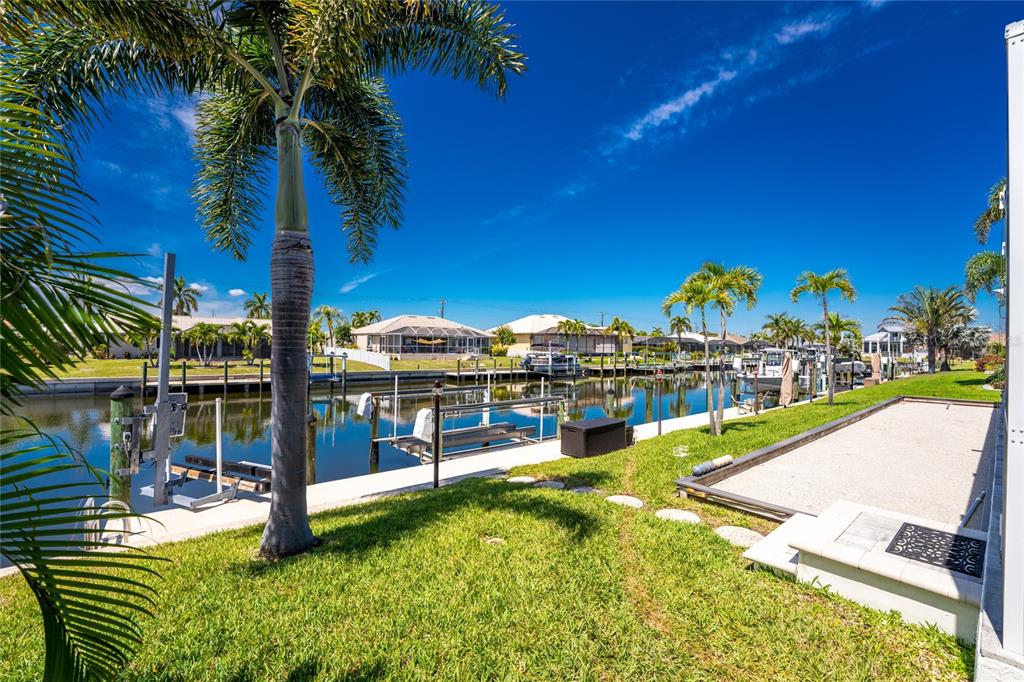 391 Vía Esplanade Punta Gorda, FL 33950 - Photo 33 of 60 a view of a swimming pool with a patio