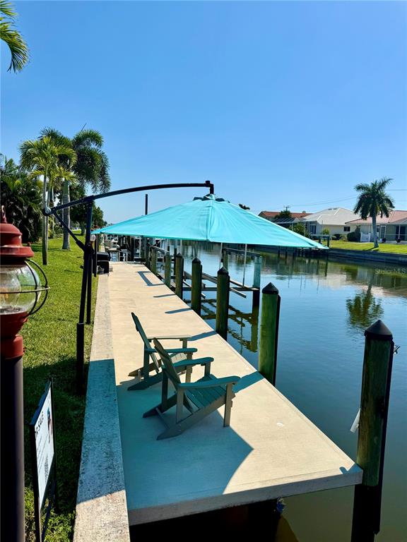 391 Vía Esplanade Punta Gorda, FL 33950 - Photo 35 of 60 a view of a chairs and table on the deck