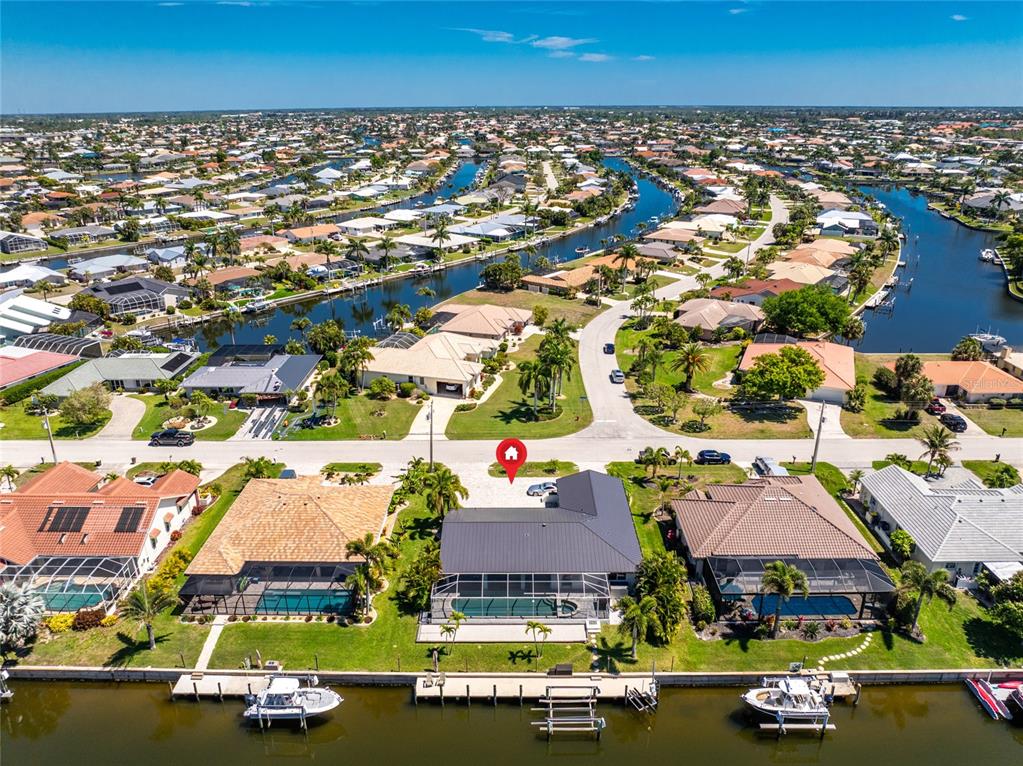 391 Vía Esplanade Punta Gorda, FL 33950 - Photo 36 of 60 an aerial view of residential houses with outdoor space
