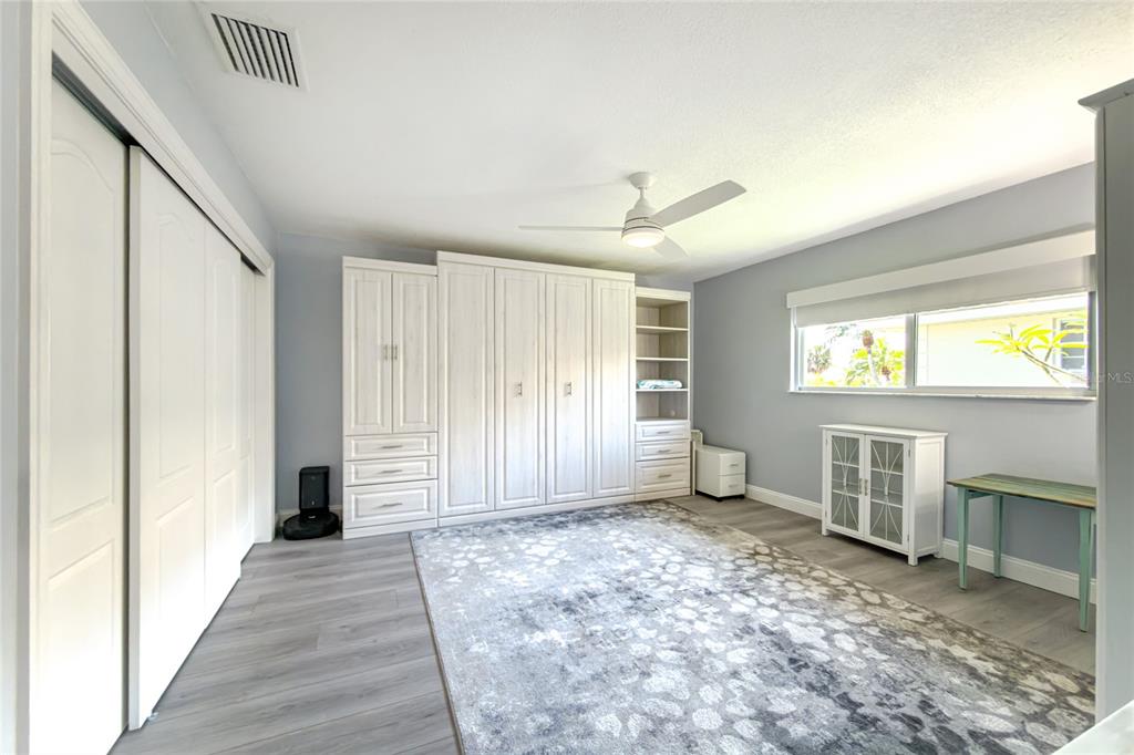 391 Vía Esplanade Punta Gorda, FL 33950 - Photo 38 of 60 a view of an empty room with a fireplace and a window