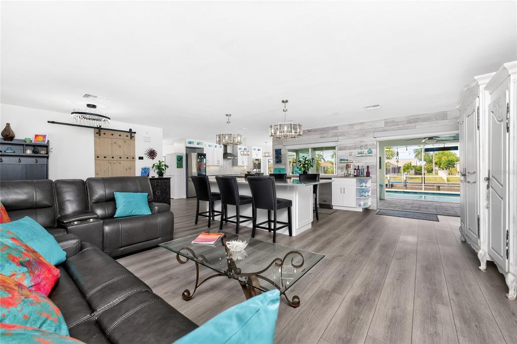 391 Vía Esplanade Punta Gorda, FL 33950 - Photo 4 of 60 a living room with furniture and a wooden floor