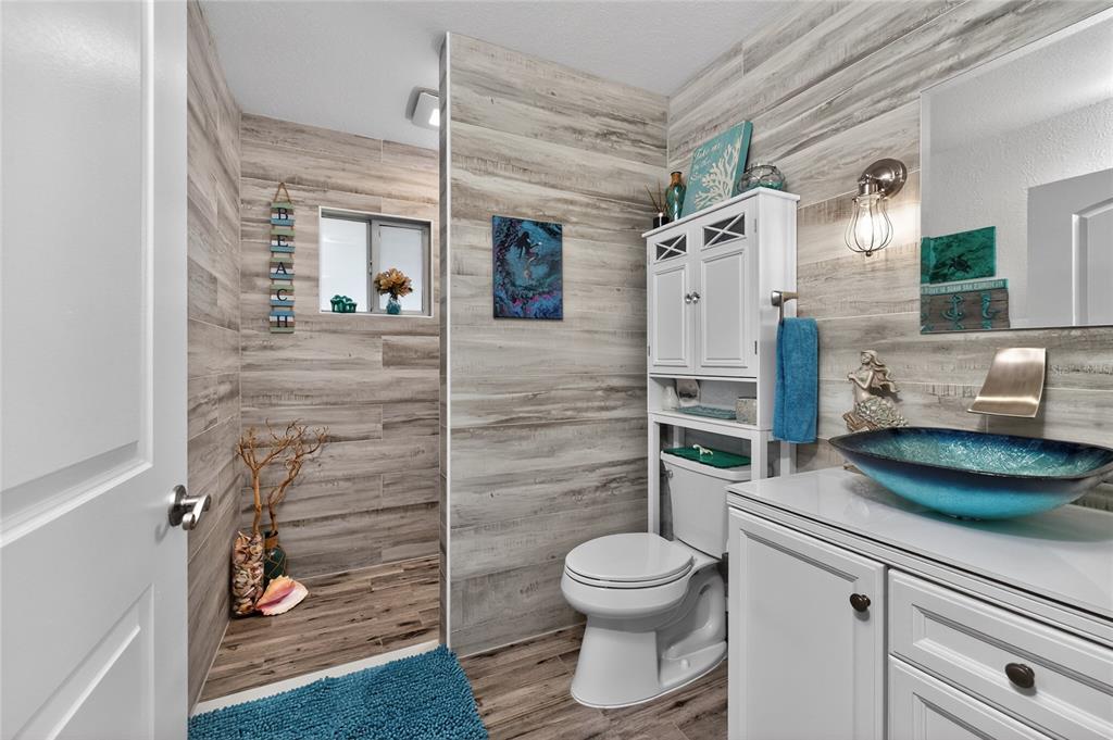 391 Vía Esplanade Punta Gorda, FL 33950 - Photo 41 of 60 a bathroom with a toilet and a shower