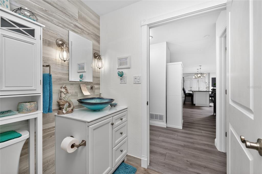 391 Vía Esplanade Punta Gorda, FL 33950 - Photo 44 of 60 a bathroom with a sink vanity and a mirror