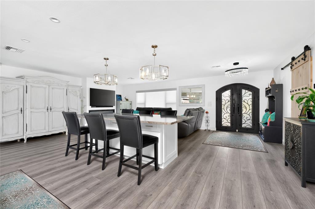 391 Vía Esplanade Punta Gorda, FL 33950 - Photo 45 of 60 a view of a dining room with furniture window and wooden floor