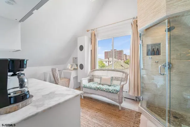 a spacious bedroom with a large bed and a large window