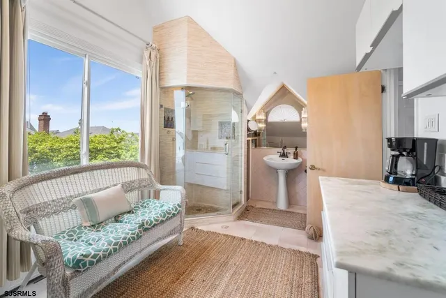 a bathroom with a toilet sink vanity and mirror