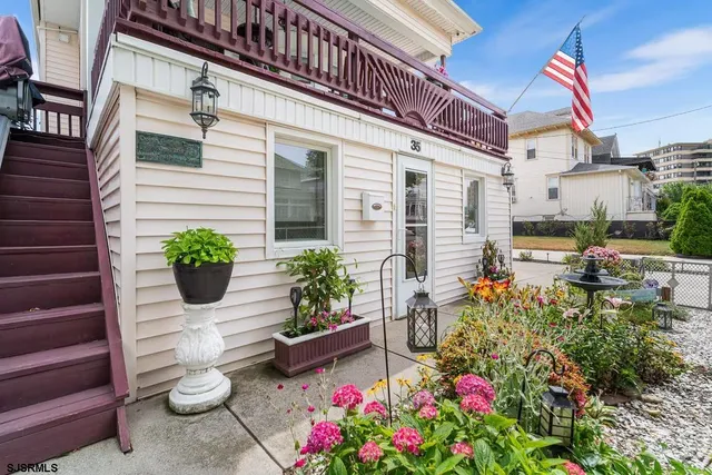 a potted plant sitting in front of a house