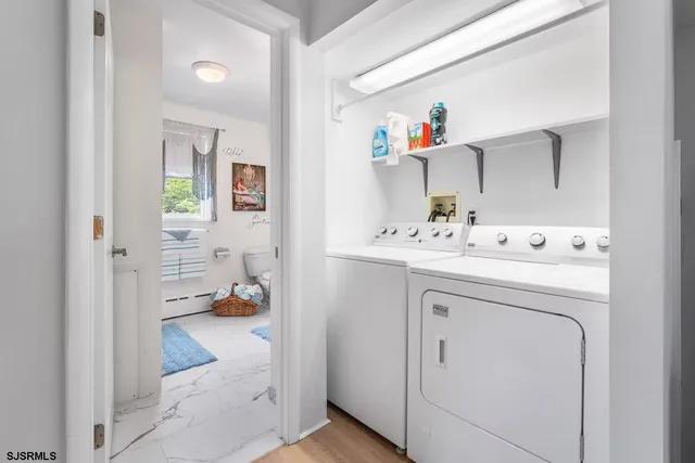 a utility room with washer and dryer