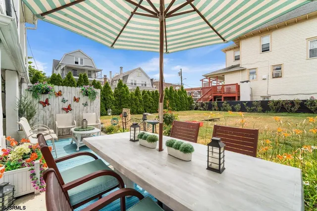 a view of a chairs and table in the patio