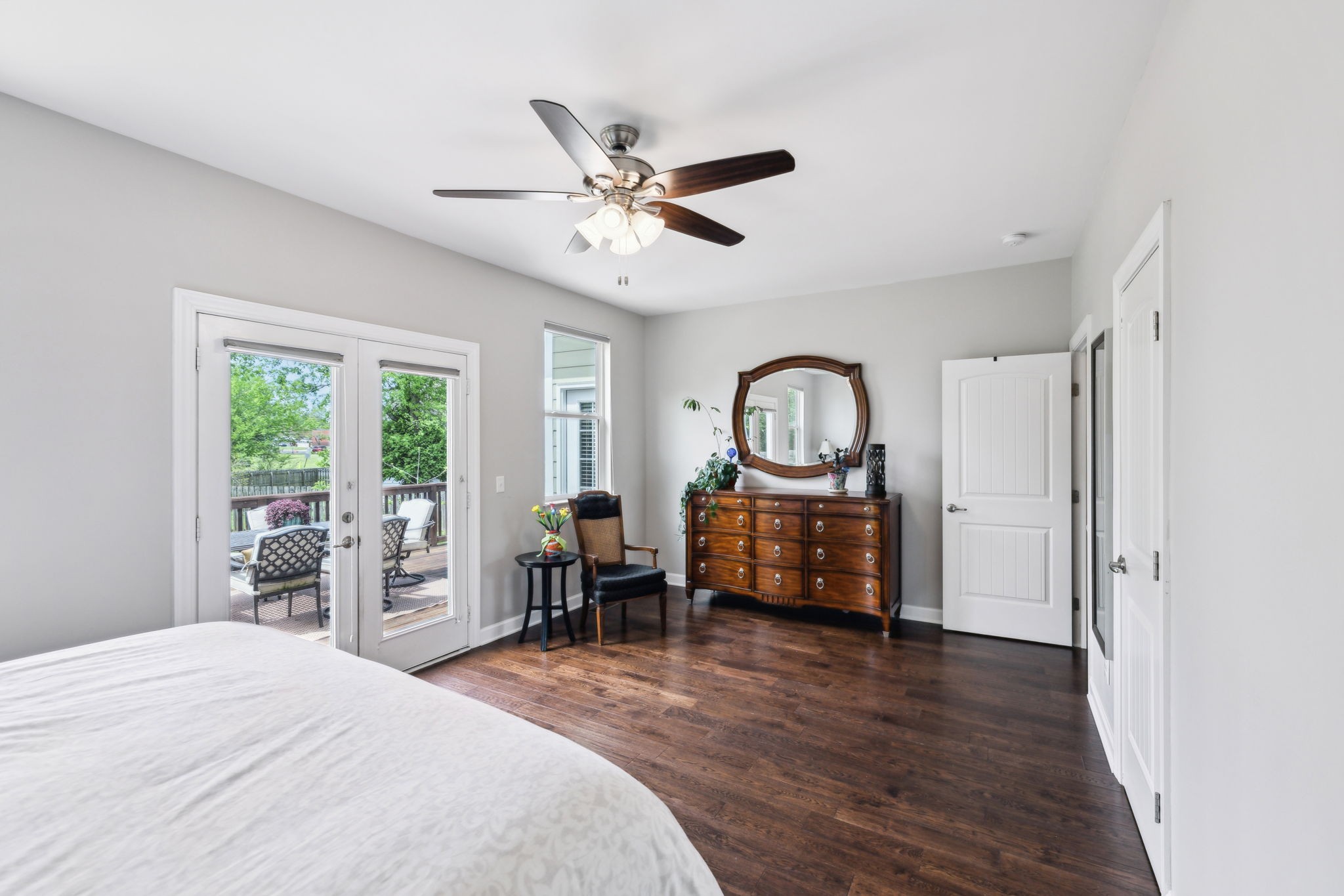 712 Ellie Drive Madison, TN 37115 - Photo 17 of 35 a bedroom with a bed and a dresser with wooden floor