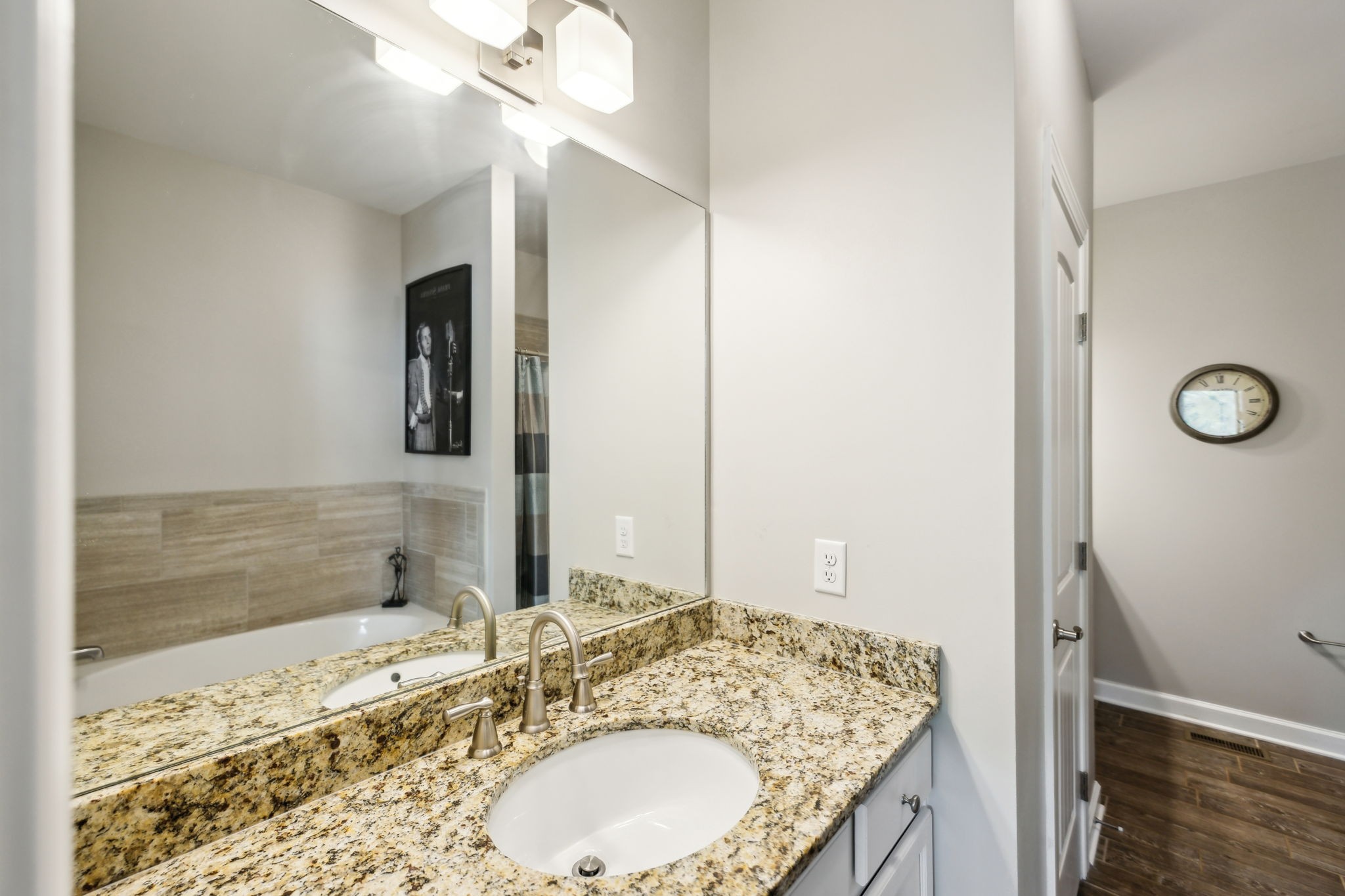 712 Ellie Drive Madison, TN 37115 - Photo 19 of 35 a bathroom with a granite countertop sink and a mirror