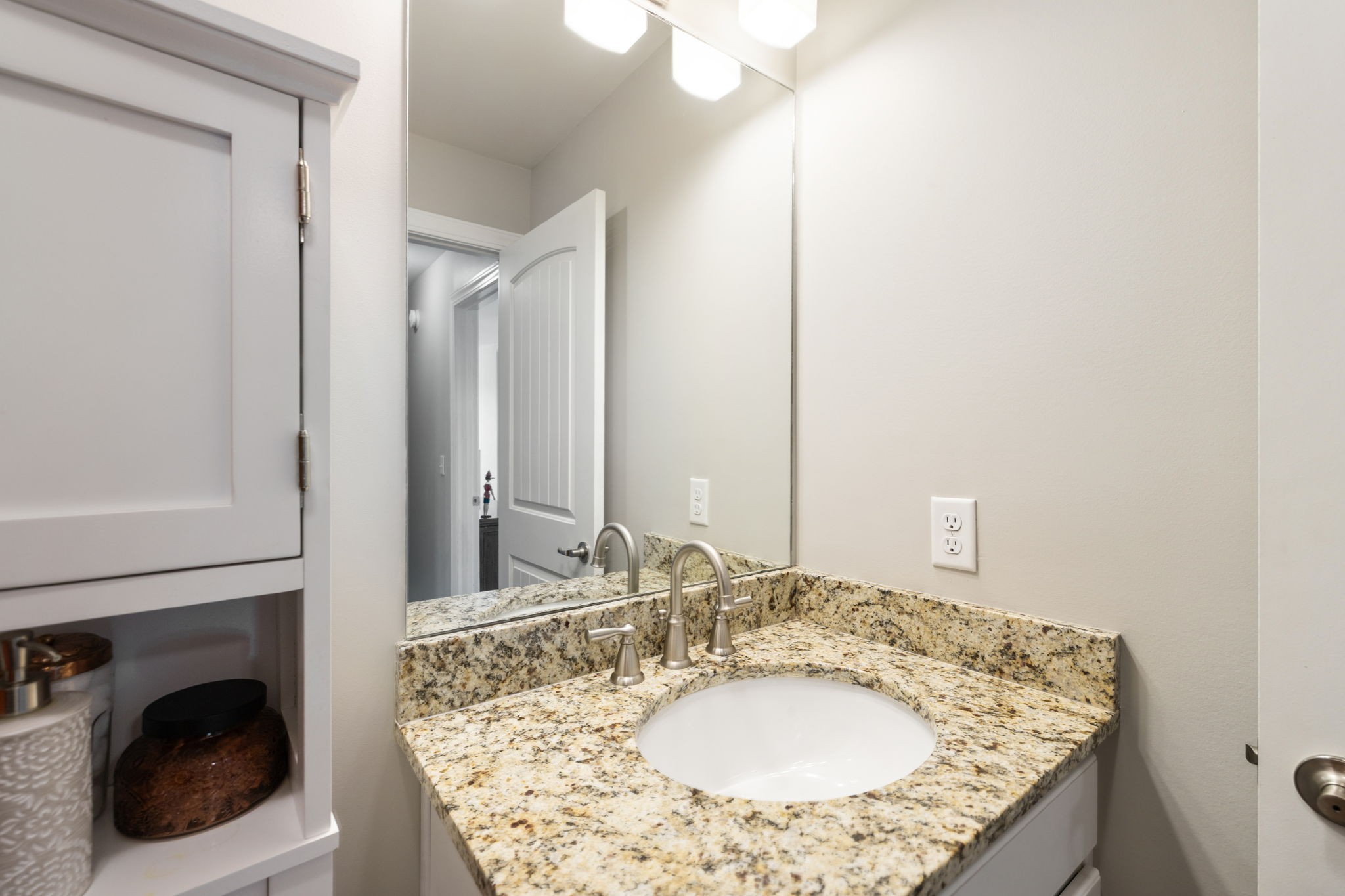 712 Ellie Drive Madison, TN 37115 - Photo 21 of 35 a bathroom with a granite countertop sink and a mirror