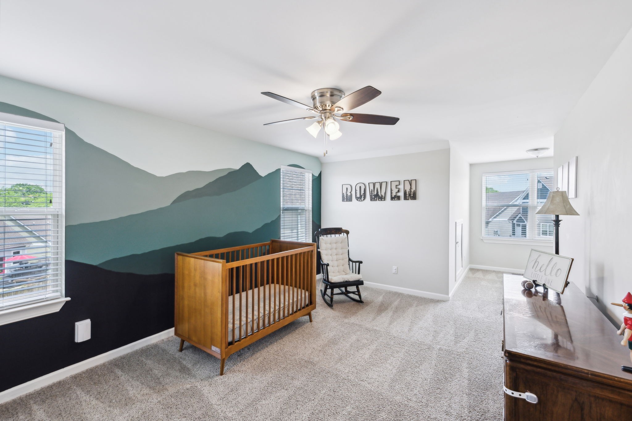 712 Ellie Drive Madison, TN 37115 - Photo 22 of 35 a bedroom with a bed and a chandelier