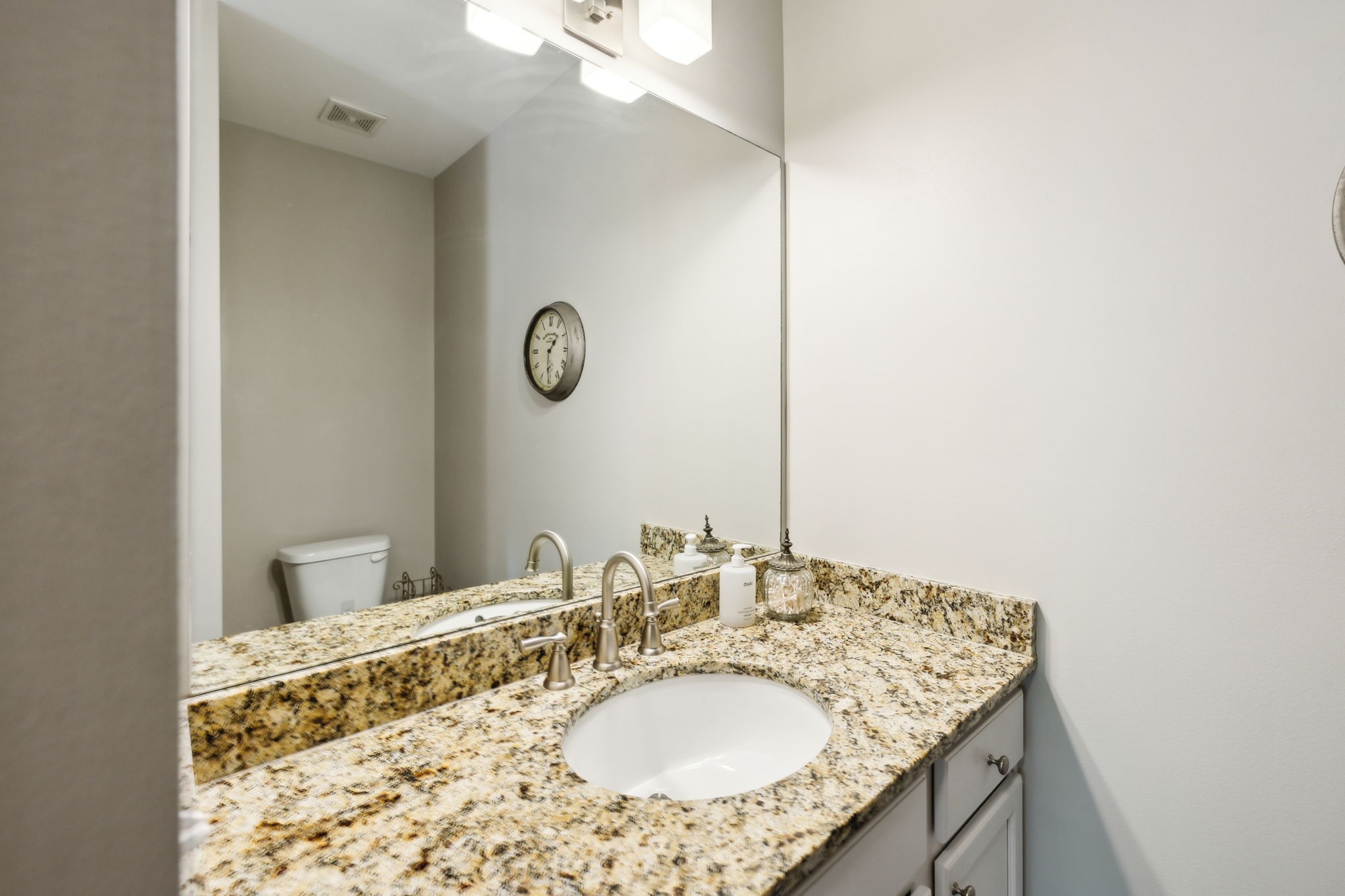 712 Ellie Drive Madison, TN 37115 - Photo 23 of 35 a bathroom with a granite countertop sink and a mirror