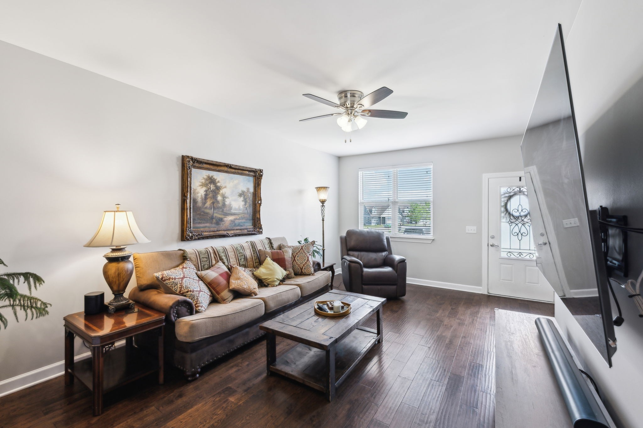 712 Ellie Drive Madison, TN 37115 - Photo 5 of 35 a living room with furniture a flat screen tv and a window