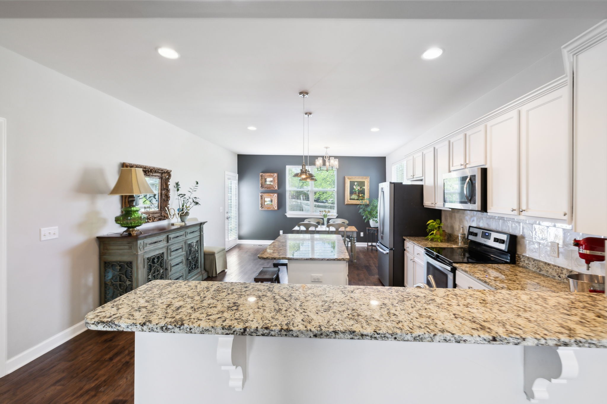 712 Ellie Drive Madison, TN 37115 - Photo 7 of 35 a kitchen with stainless steel appliances granite countertop a sink stove and refrigerator