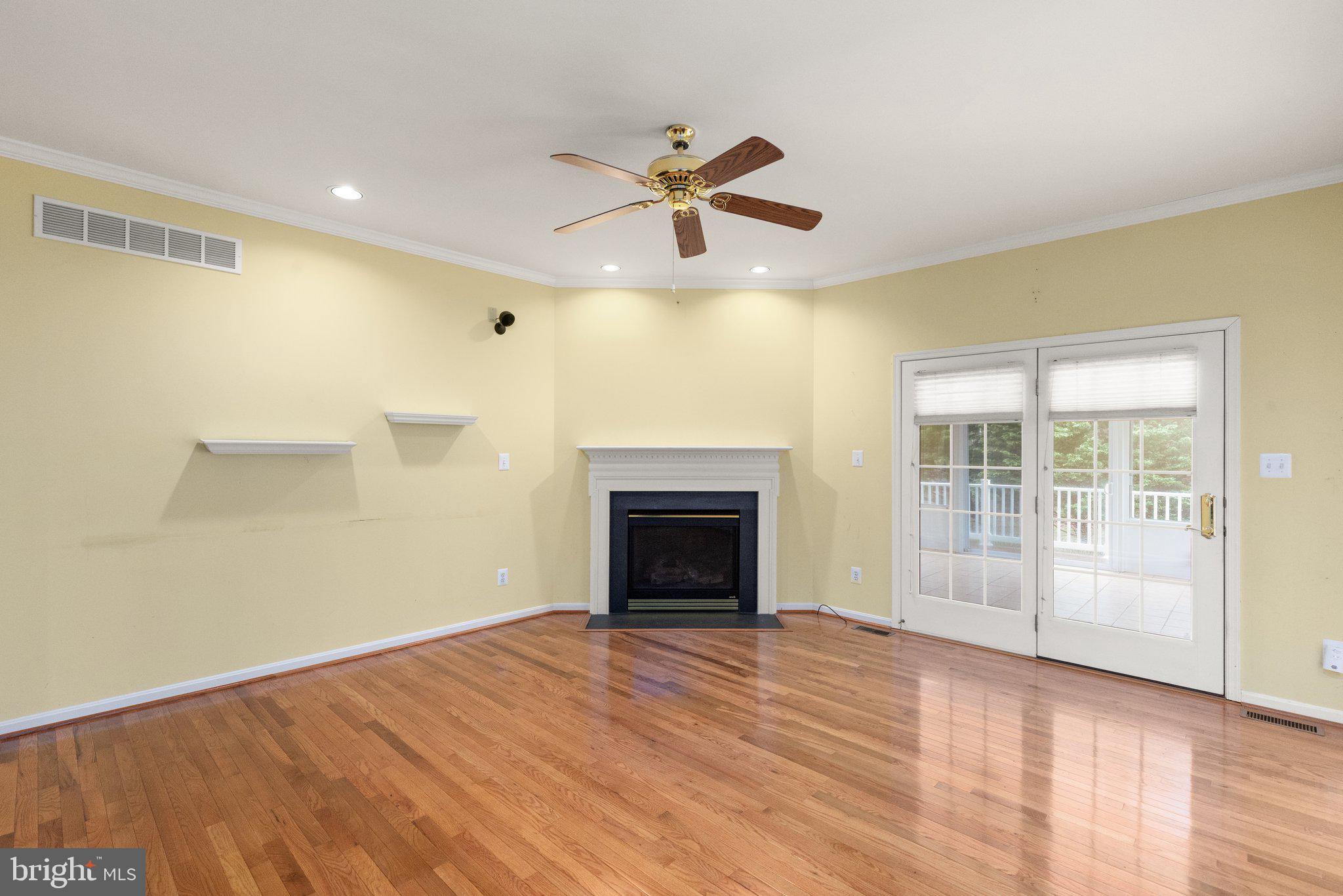 511 Copeland Road Fallston, MD 21047 - Photo 11 of 49 a view of an empty room with wooden floor fireplace and a window