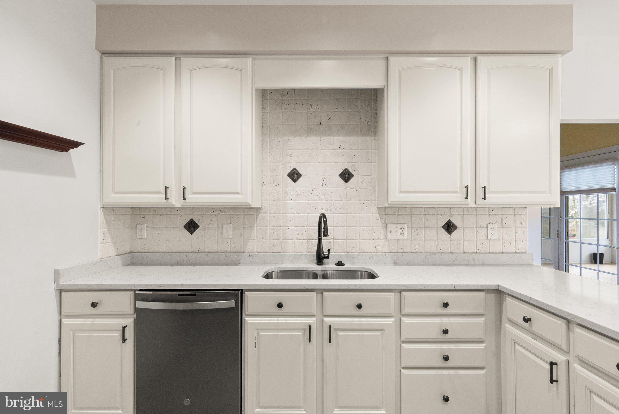 511 Copeland Road Fallston, MD 21047 - Photo 19 of 49 a kitchen with white cabinets and sink