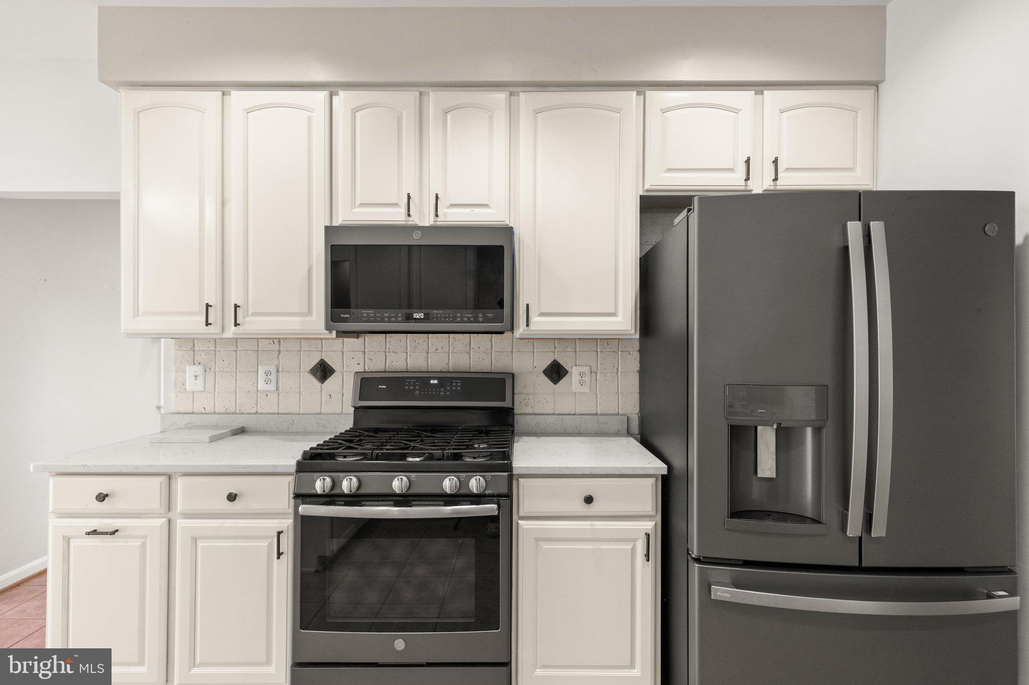 511 Copeland Road Fallston, MD 21047 - Photo 20 of 49 a kitchen with stainless steel appliances white cabinets and a refrigerator