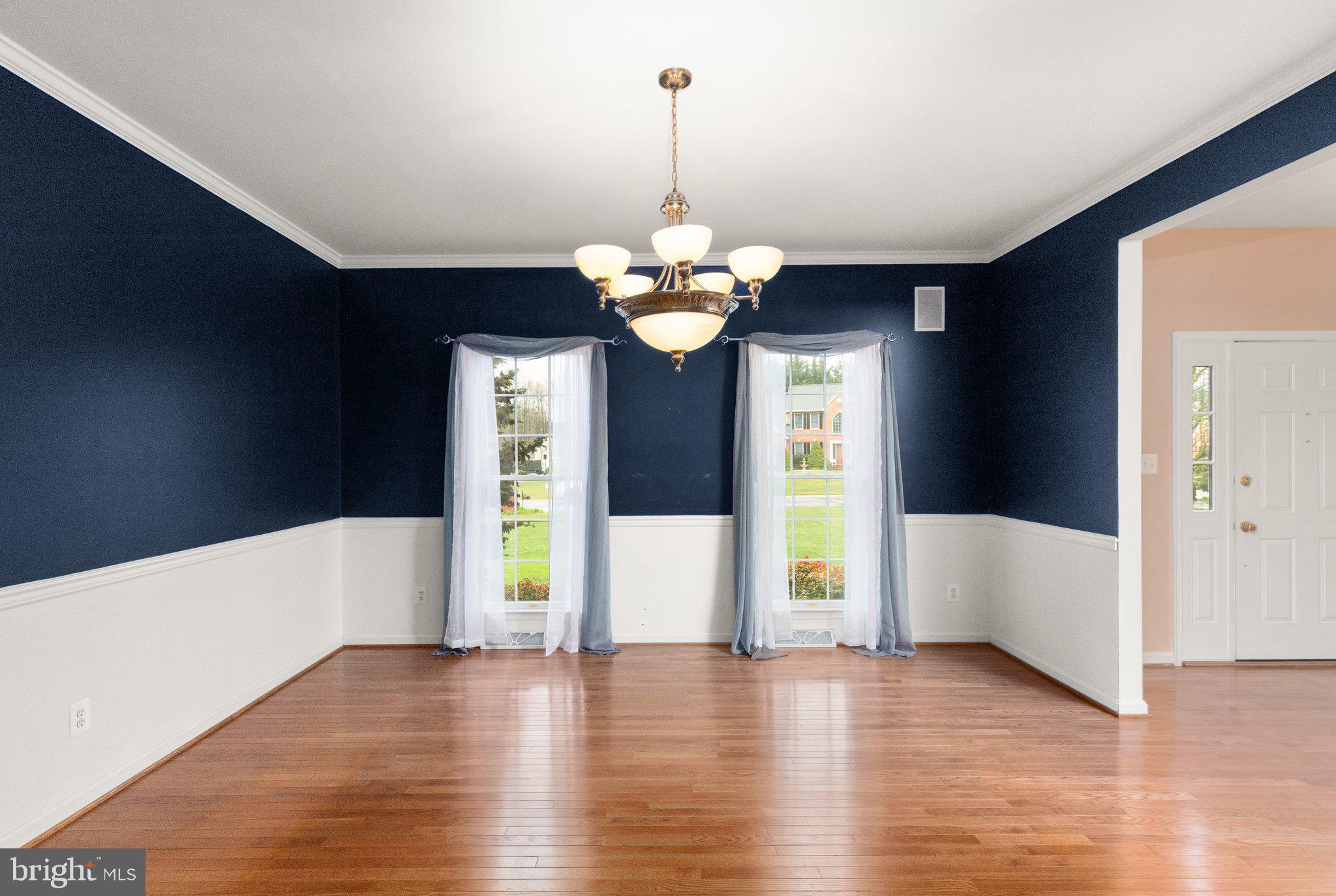 511 Copeland Road Fallston, MD 21047 - Photo 3 of 49 a view of an empty room with window and wooden floor