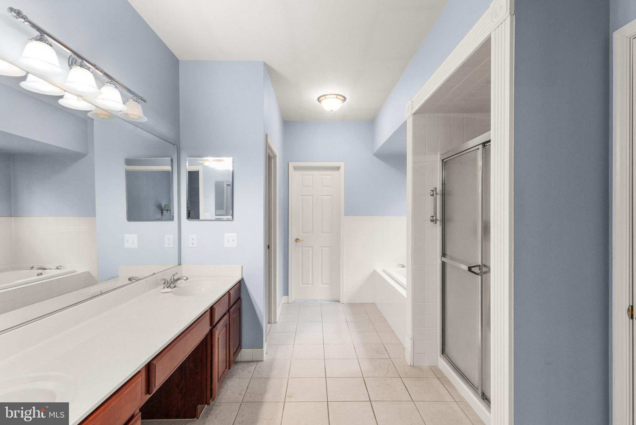 511 Copeland Road Fallston, MD 21047 - Photo 8 of 49 a spacious bathroom with a double vanity sink a mirror and a shower