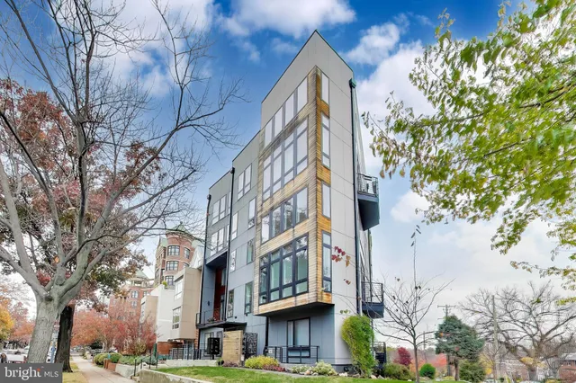 a view of a balcony with wooden floor