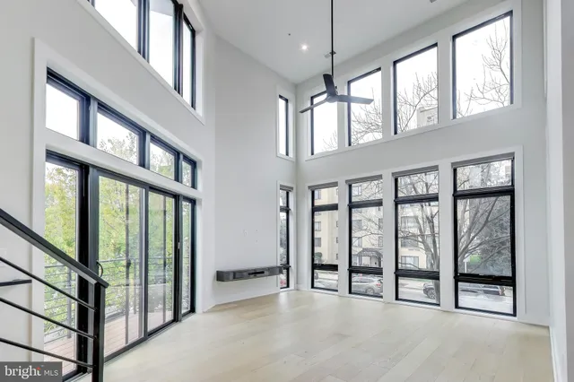 a view of a kitchen with a sink and dishwasher a refrigerator with wooden floor