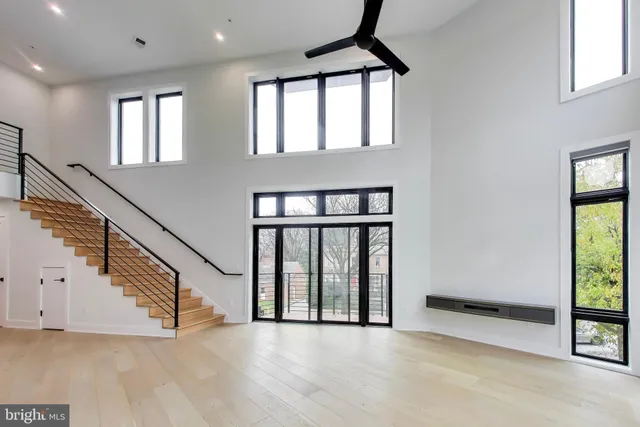 a kitchen with stainless steel appliances a refrigerator sink and microwave