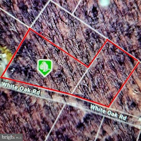 a picture of a room with a small space and a wooden bench