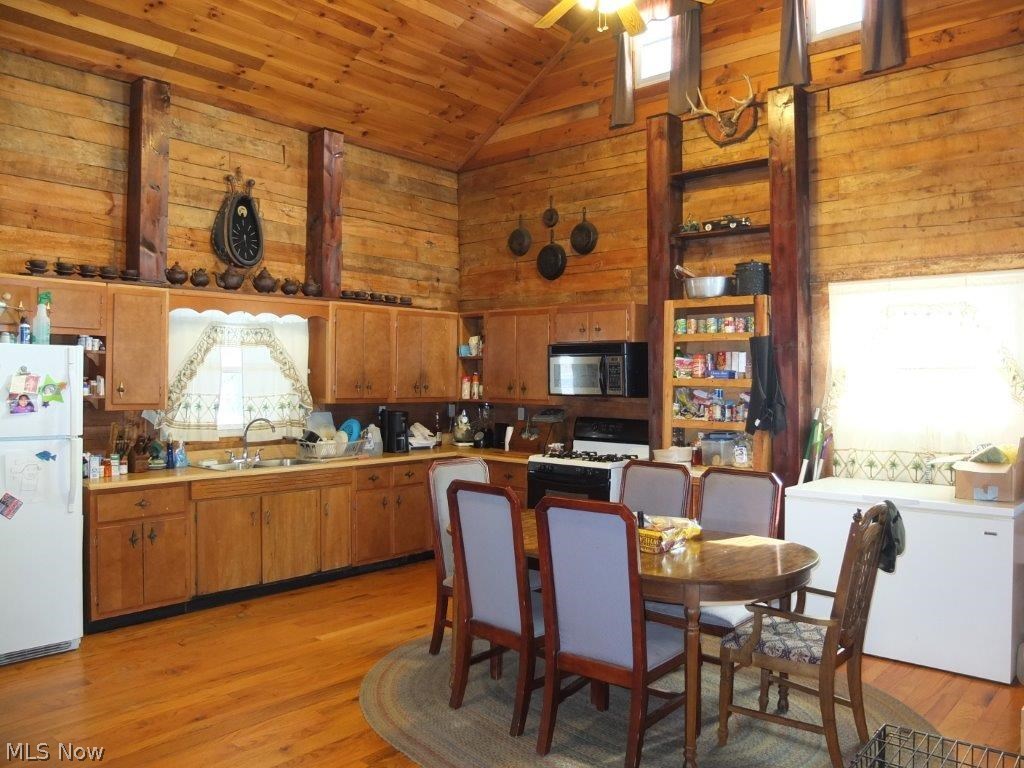 7739 Kendle Road Northwest Dover, OH 44622 - Photo 2 of 14 Spacious, eat-in kitchen with vaulted ceiling and hardwood floor.