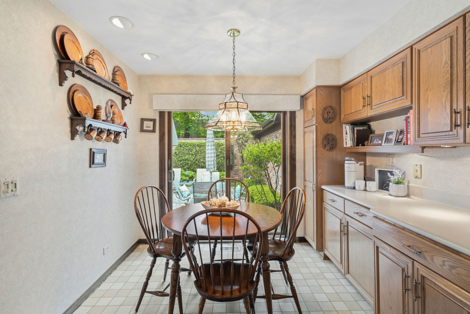 715 Tomlin Drive, Unit A1 Burr Ridge, IL 60527 - Photo 10 of 24 a dining room with furniture a chandelier and window