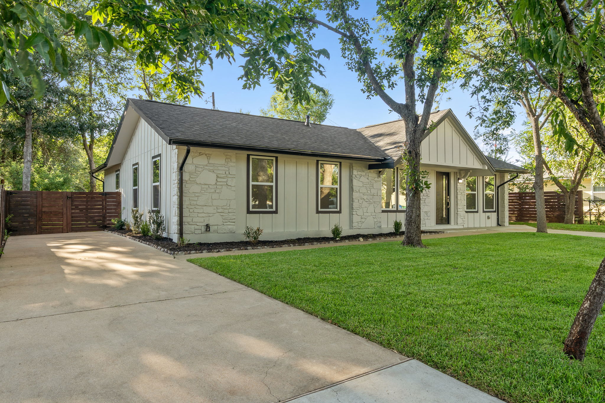 4802 Brighton Road Austin, TX 78745 - Photo 27 of 30 A second driveway provides excellent access to the rear of the property. The oversized lot offers ample space for the addition of a detached structure or expanded outdoor amenities.