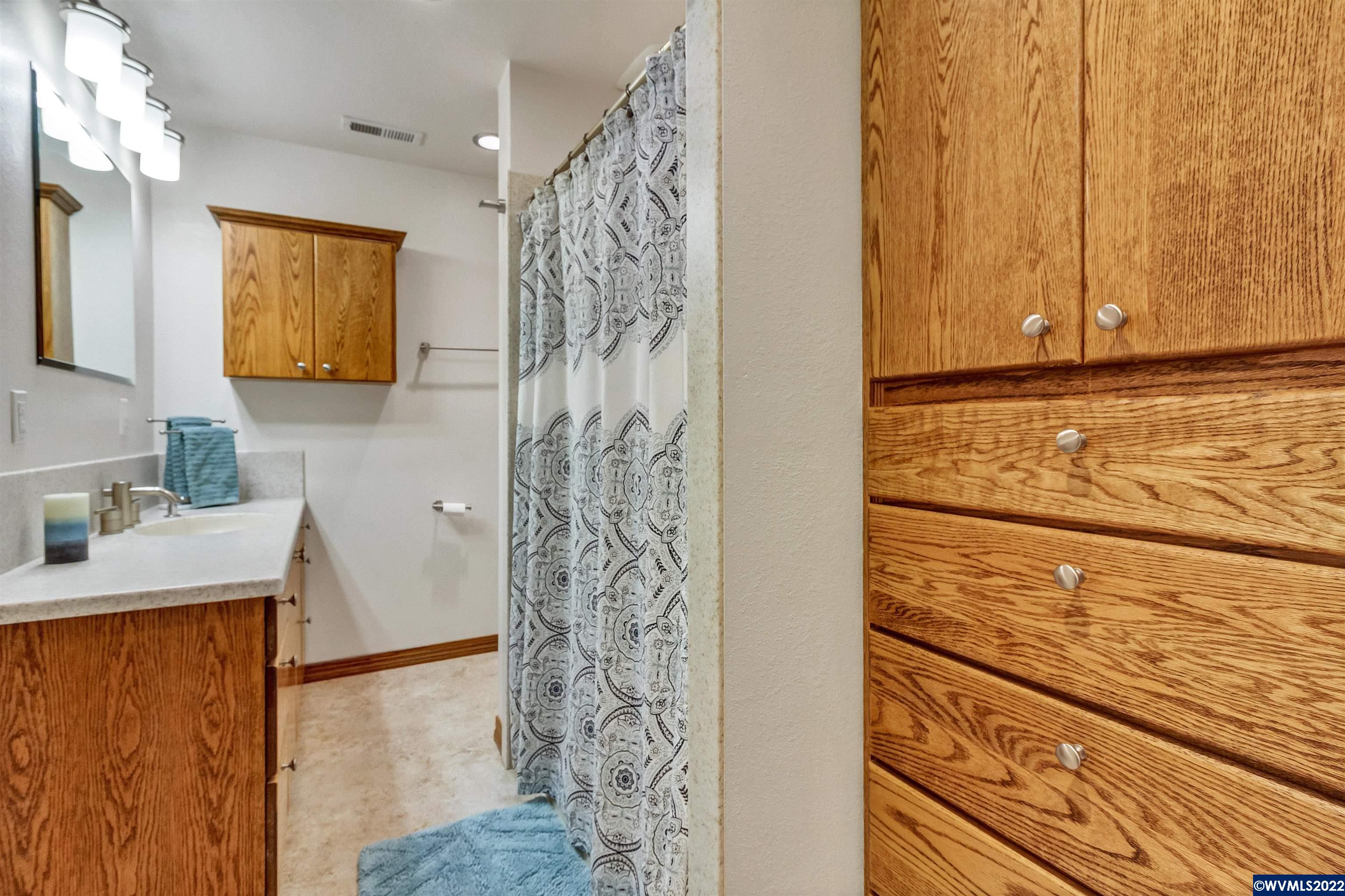150 Edwards Road South Monmouth, OR 97361 - Photo 19 of 39 a bathroom with a shower curtain and a sink